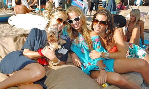 Paris Hilton, left, with her dog Cinderella, an unidentified woman and Jessica Meisels, right, at the Polaroid Beach House in Malibu.