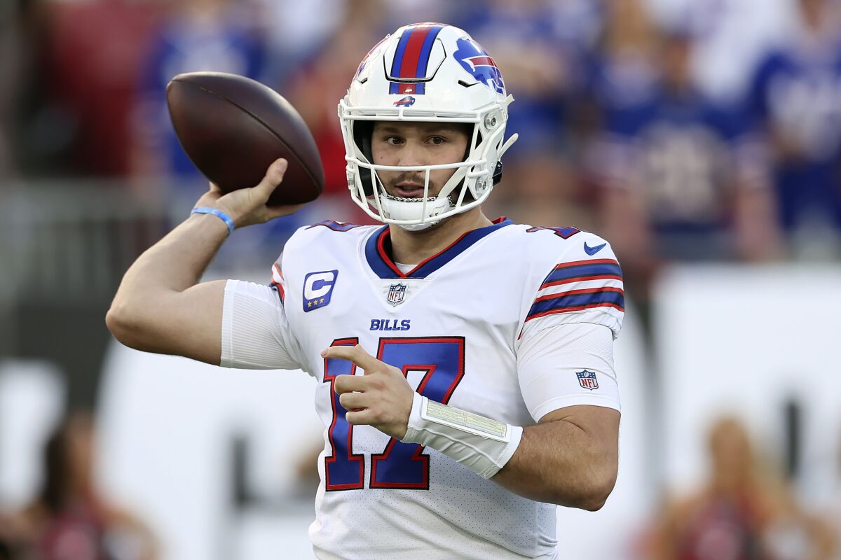 Buffalo Bills quarterback Josh Allen (17) throws a pass against the Tampa Bay Buccaneers during the first half of an NFL football game Sunday, Dec. 12, 2021, in Tampa, Fla. (AP Photo/Mark LoMoglio)