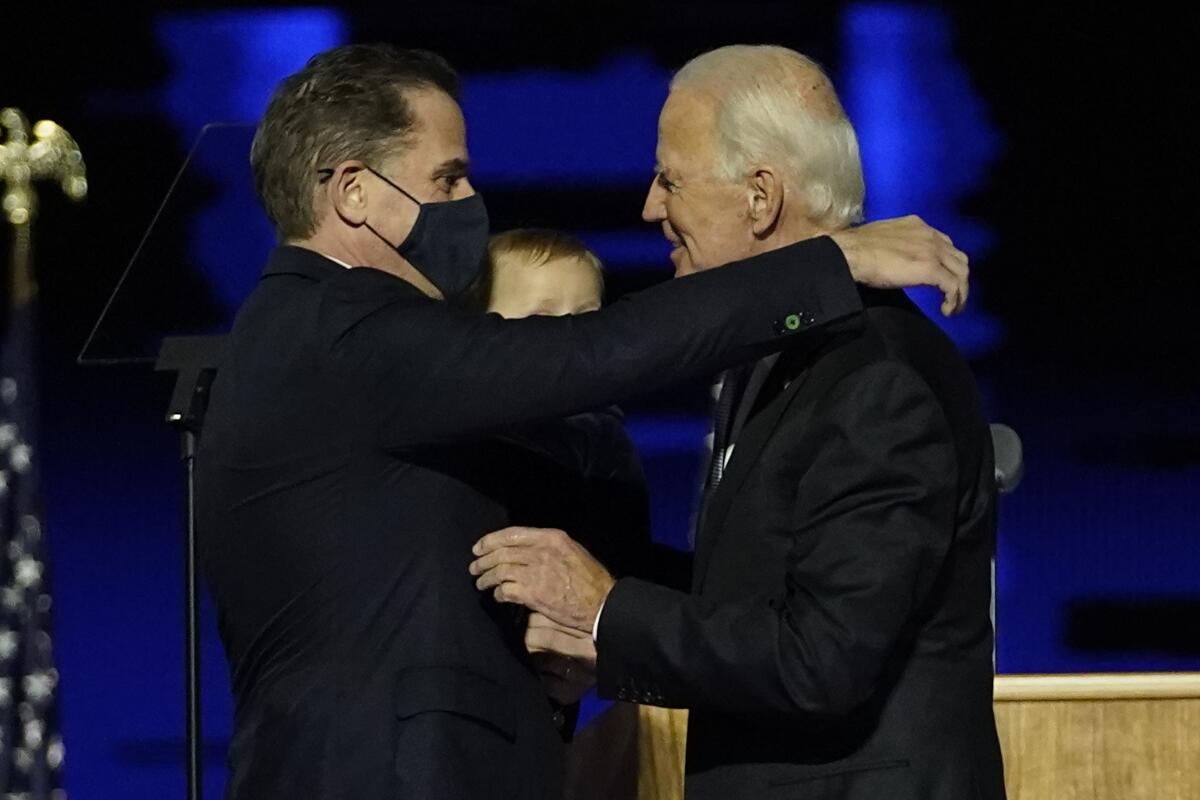 President-elect Joe Biden, right, embraces son Hunter