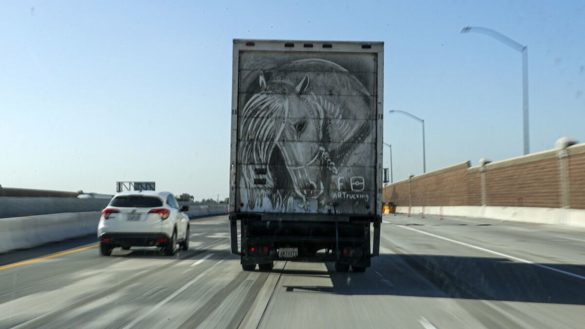 Arnulfo Gonzalez displays his art for all to see on the back of his truck as he drives through Norwalk.