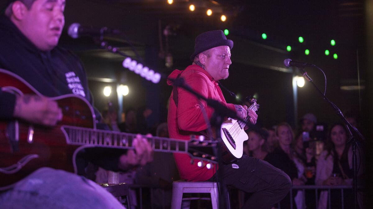 Sublime with Rome singer and guitarist Rome Ramirez, left, and bassist Eric Wilson perform at SeaLegs at the Beach in Huntington Beach in April.