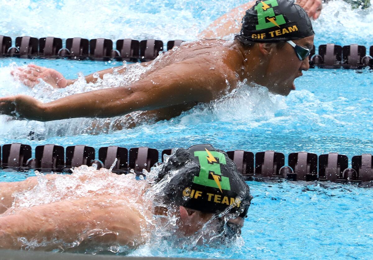 Edison's Jacob Chalabian, lower center, and Holden Lee, top right, compete in the boys' 100 yard butterfly.