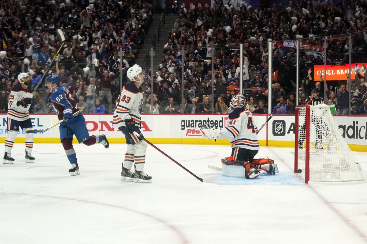 Colorado Avalanche left wing Artturi Lehkonen (62) celebrates a goal against Edmonton Oilers goaltender Mike Smith (41) during the second period in Game 2 of the NHL hockey Stanley Cup playoffs Western Conference finals Thursday, June 2, 2022, in Denver. (AP Photo/Jack Dempsey)