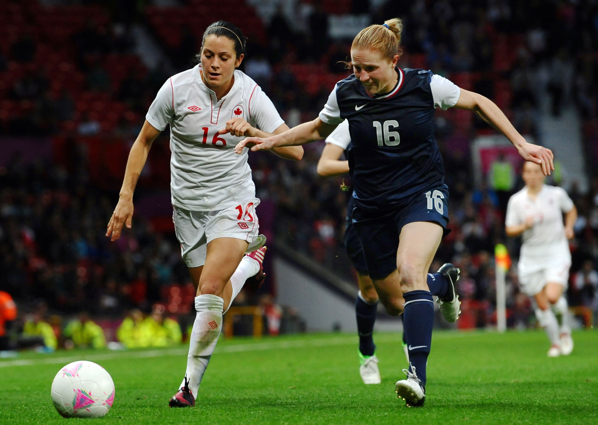 Canada forward Jonelle Filigno, left, and U.S. defender Rachel Buehler.