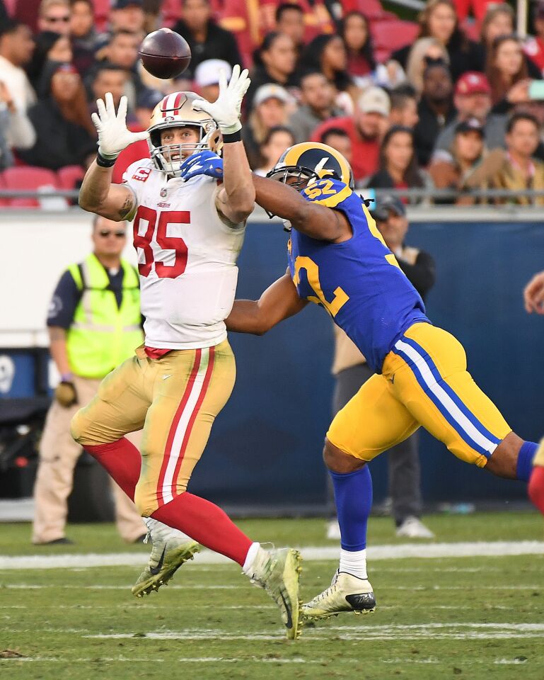 Rams linebacker Ramik Wilson prevents 49ers tight end George Kittle from catching a pass.