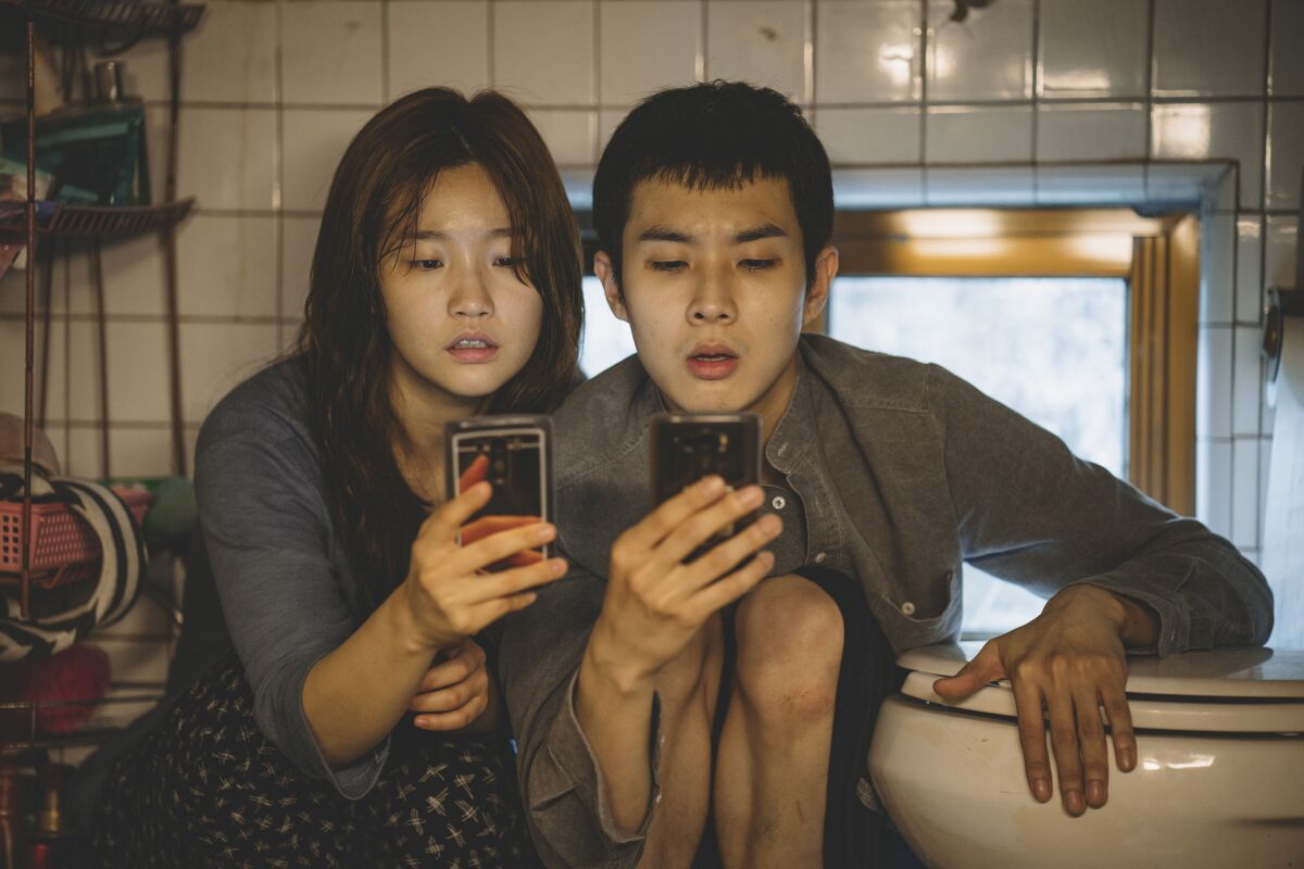  So-dam Park, left, and Woo-sik Choi in "Parasite" (2019).