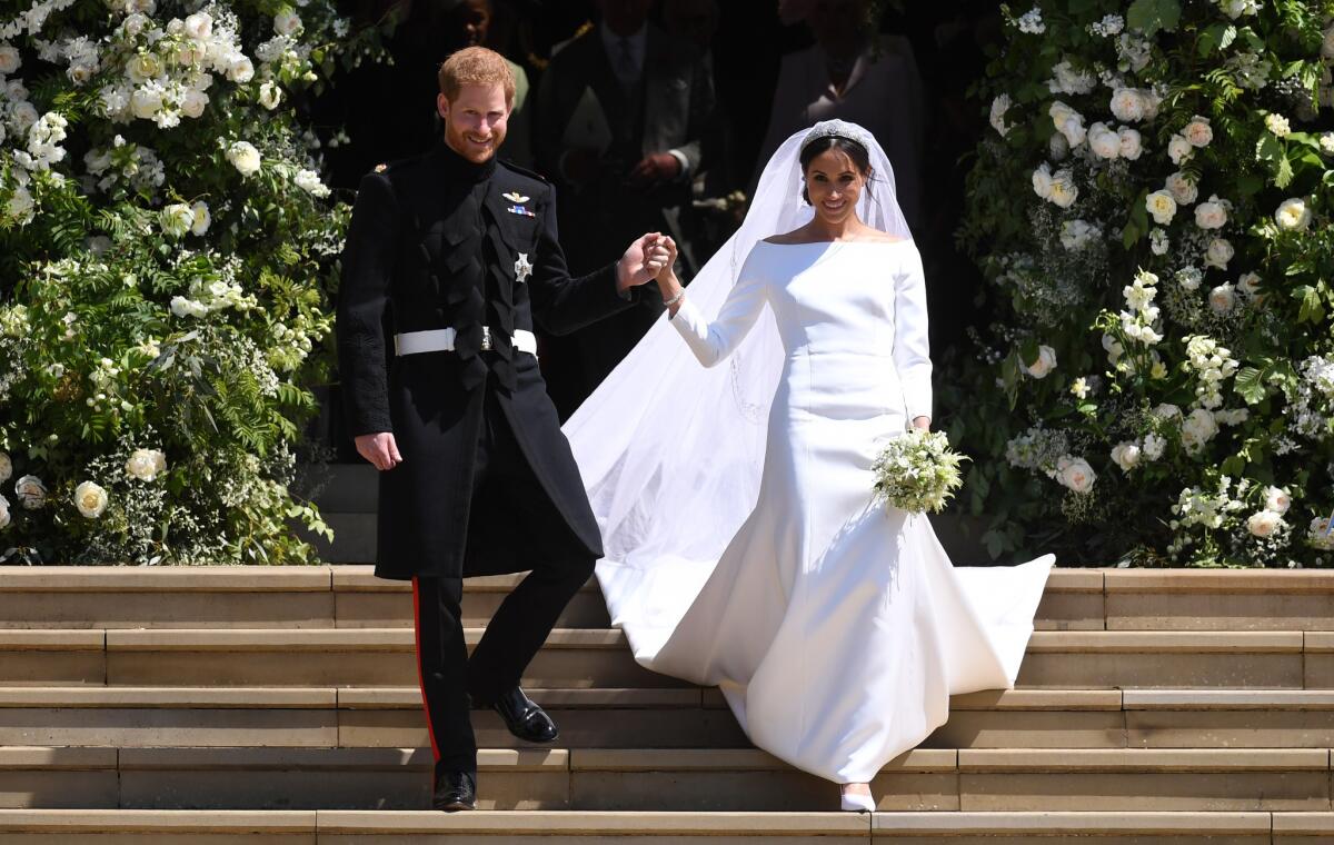 Prince Harry and Meghan Markle, now the Duke and Duchess of Sussex, leave St. George's Chapel at Windsor Castle after their May 19 wedding ceremony.