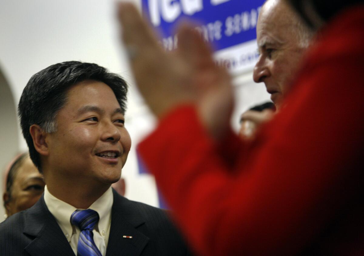 Then-Assemblyman Ted Lieu glances at Gov. Jerry Brown.