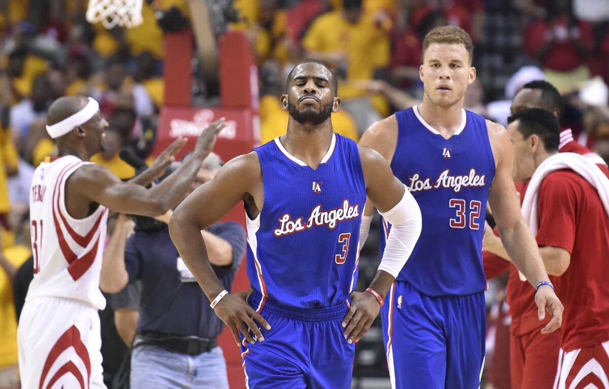 Chris Paul and Blake Griffin walk off the court while trailing in Houston during the Clippers' Game 5 loss to the Rockets, 124-103.
