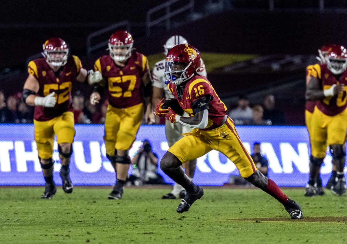 USC wide receiver Tahj Washington finds open field after a reception against Arizona.