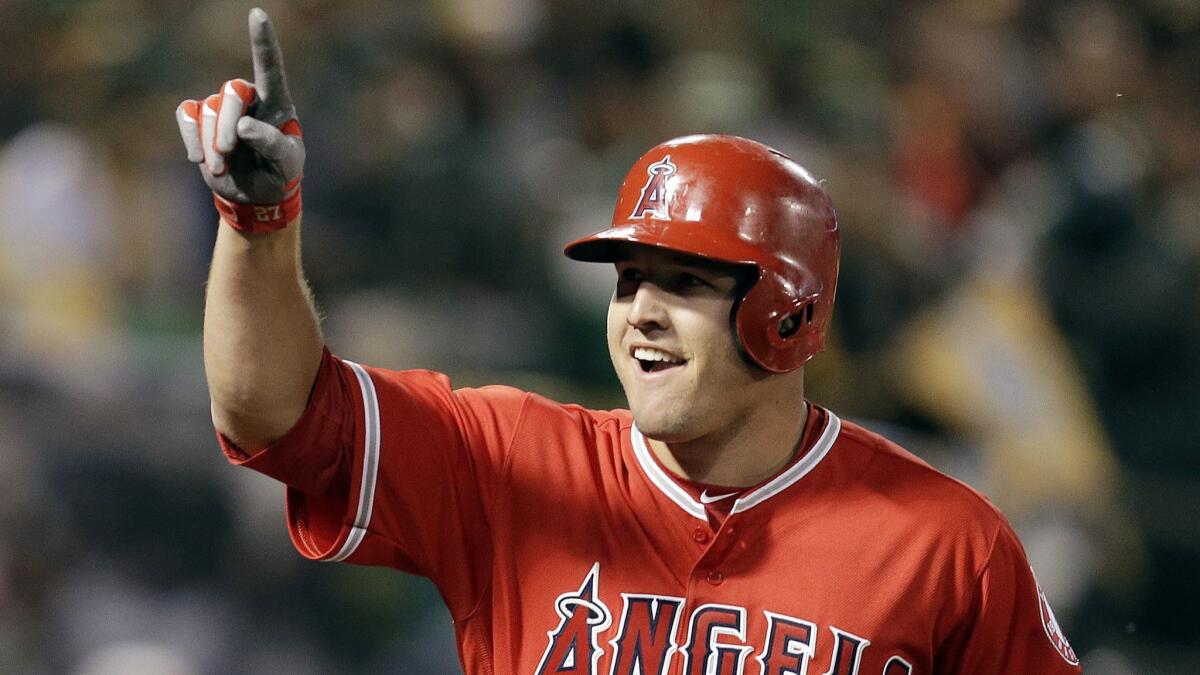 Angels' Mike Trout celebrates after hitting a two-run home run off Oakland Athletics' Kendall Graveman in the third inning of a baseball game in Oakland on April 3, 2017.