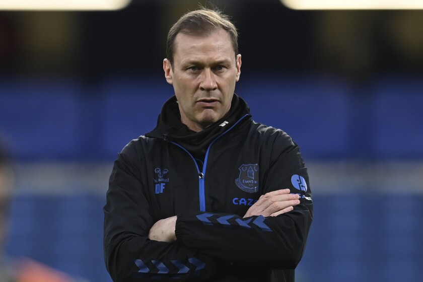 FILE - Everton assistant manager Duncan Ferguson looks on before their English Premier League soccer match against Chelsea at the Stamford Bridge stadium in London, March 8, 2021. Everton has on Tuesday, Jan. 18, 2022 promoted Ferguson to caretaker manager while it searches for Rafa Benitez’s successor. The former Scotland and Everton striker Ferguson took charge for three games in 2019 following the dismissal of Marco Silva and he has remained on the coaching staff. (Glyn Kirk/Pool via AP, file)