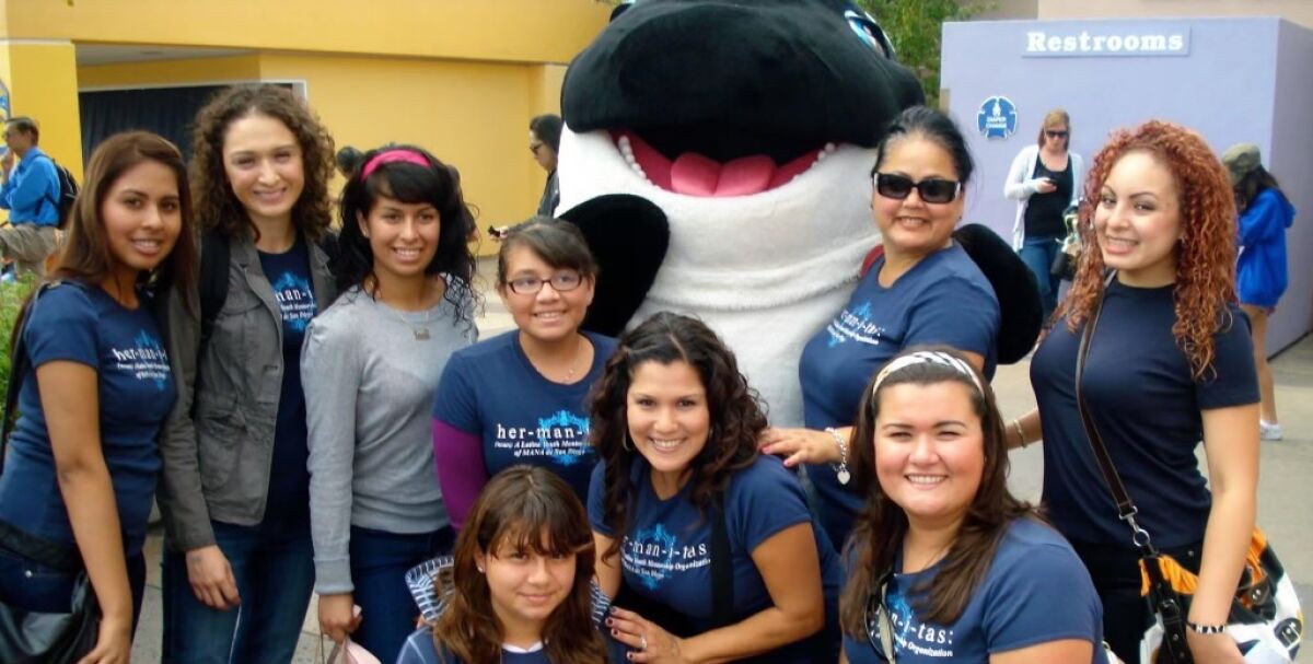 Kimberly Meraz, then 11, (kneeling in front) with her MANA Hermanitas and mentors at Sea World in 2010.