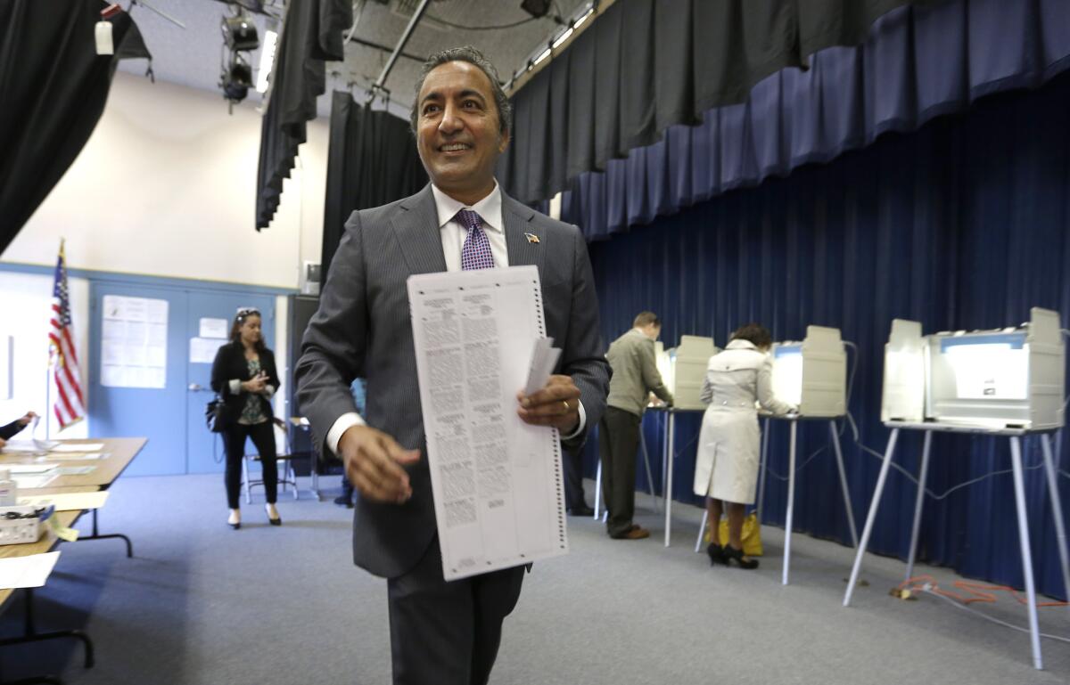 Rep. Ami Bera (D-Elk Grove), who just won an extremely close race with Republican Doug Ose, prepares to cast his ballot on election day.