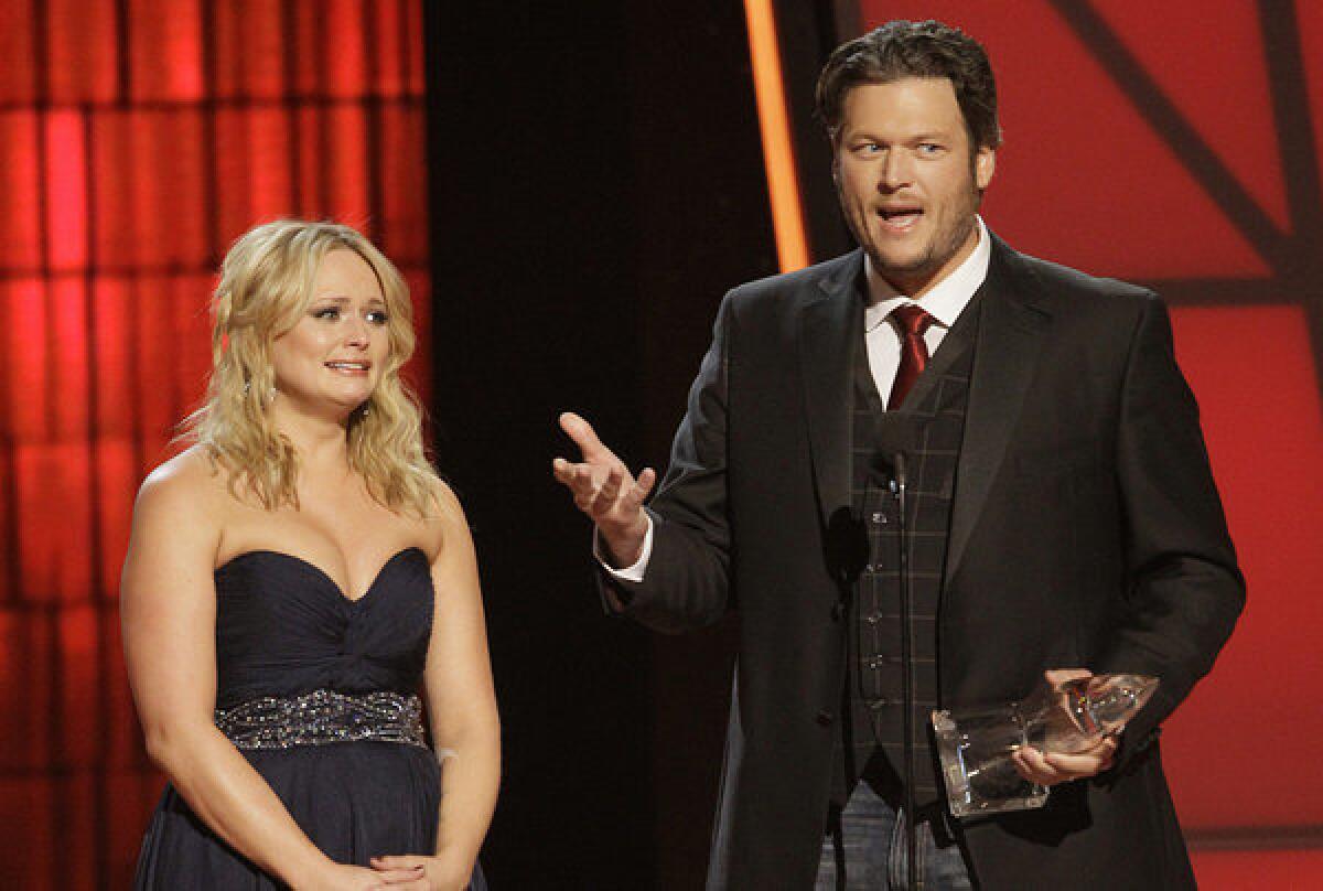 Miranda Lambert and Blake Shelton collected five top awards between them at Thursday's 46th CMA Awards in Nashville.