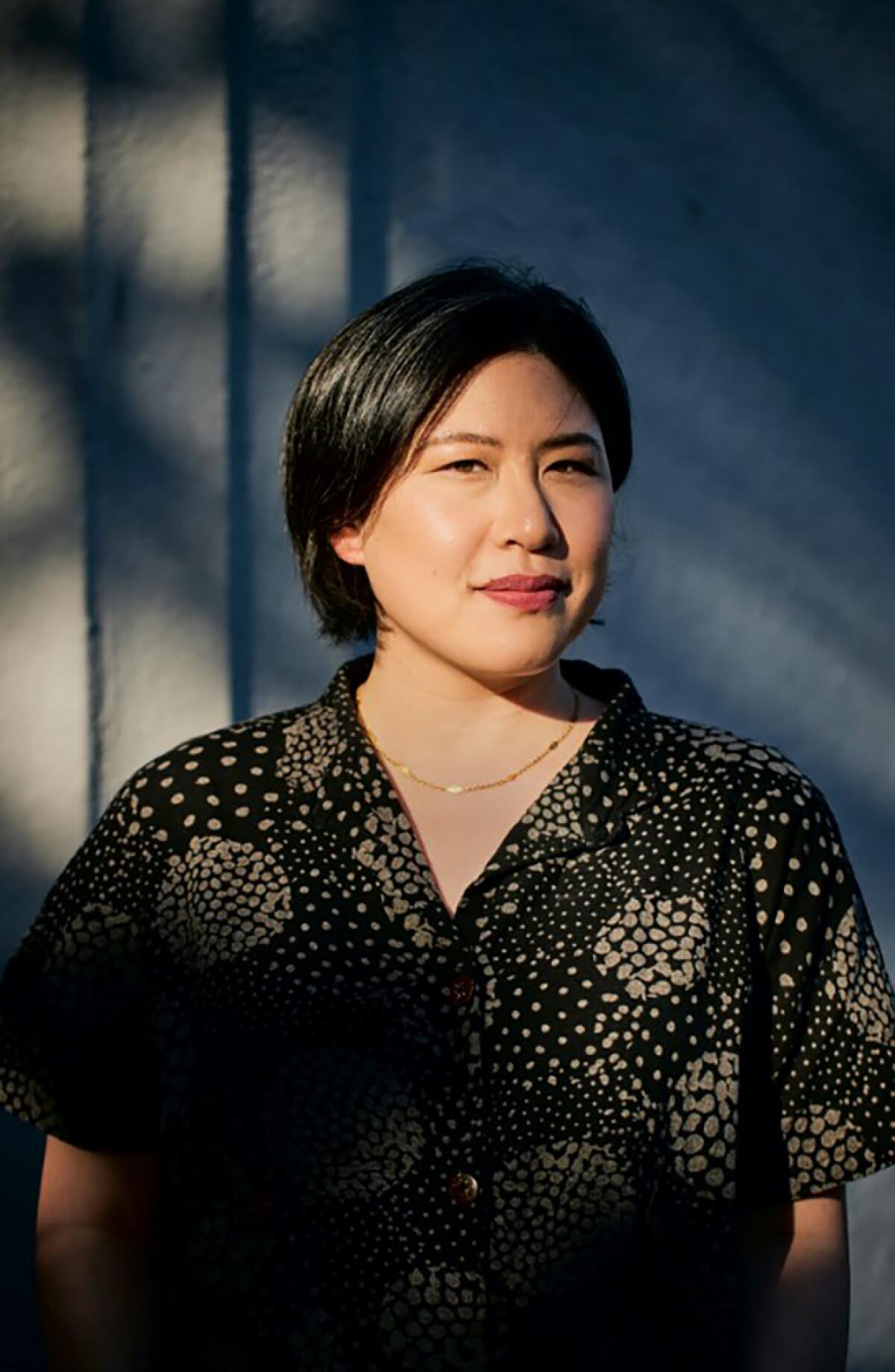 Author Susanna Kwan wears a patterned shirt