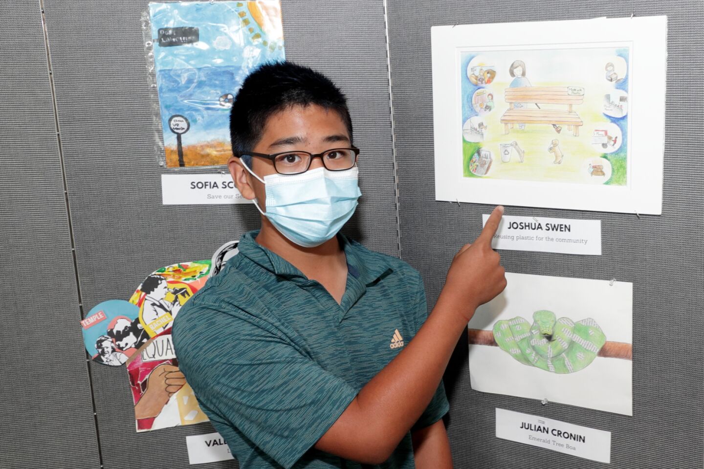 Joshua Suen with his entry "Reusing Plastic for the Community"