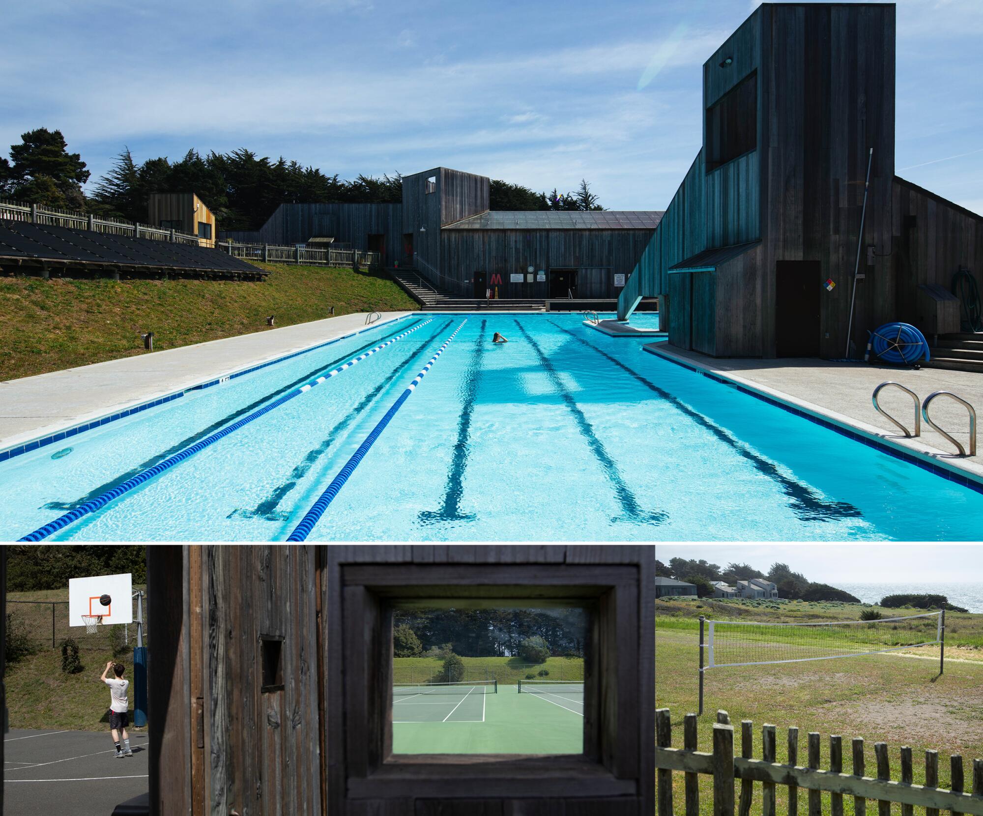 A person in a large six-lane outdoor pool flanked by geometric buildings.