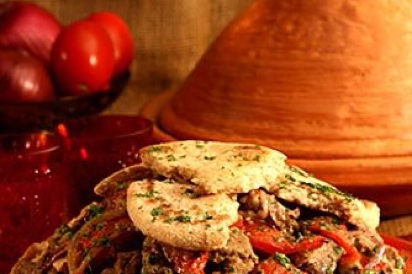 Recipe: Moroccan lamb tagine with melting tomatoes and onions