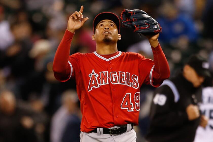 Angels closer Ernesto Frieri points skyward after recording the final out of the Angels' 2-0 win over the Seattle Mariners.