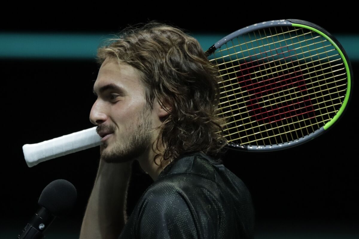 Greece's Stefanos Tsitsipas answer questions during an interview after winning against Russia's Karen Khachanov in three sets, 4-6, 6-3, 7-5, in their quarterfinal men's singles match of the ABN AMRO world tennis tournament at Ahoy Arena in Rotterdam, Netherlands, Friday, March 5, 2021. (AP Photo/Peter Dejong)