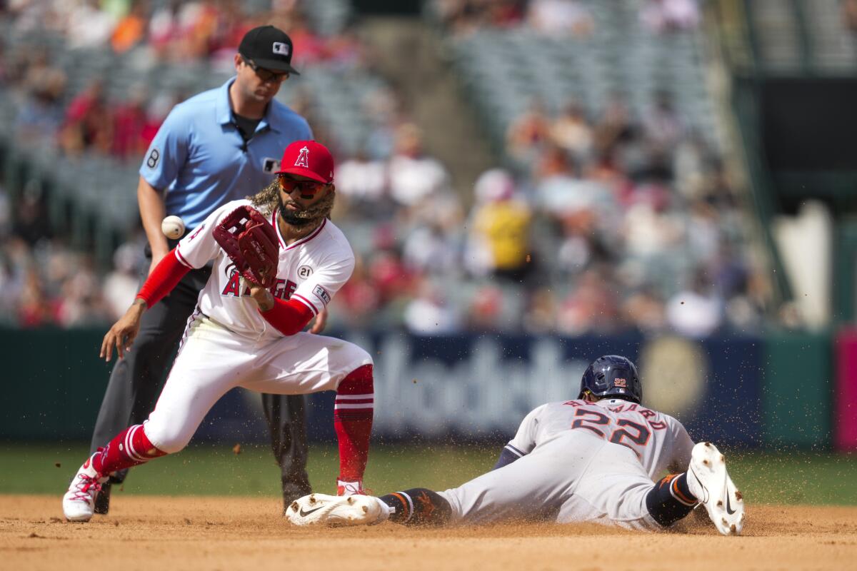 Houston's Jason Heyward steals second base ahead of a throw to Angels second baseman Jack López during the 6th inning Sunday.