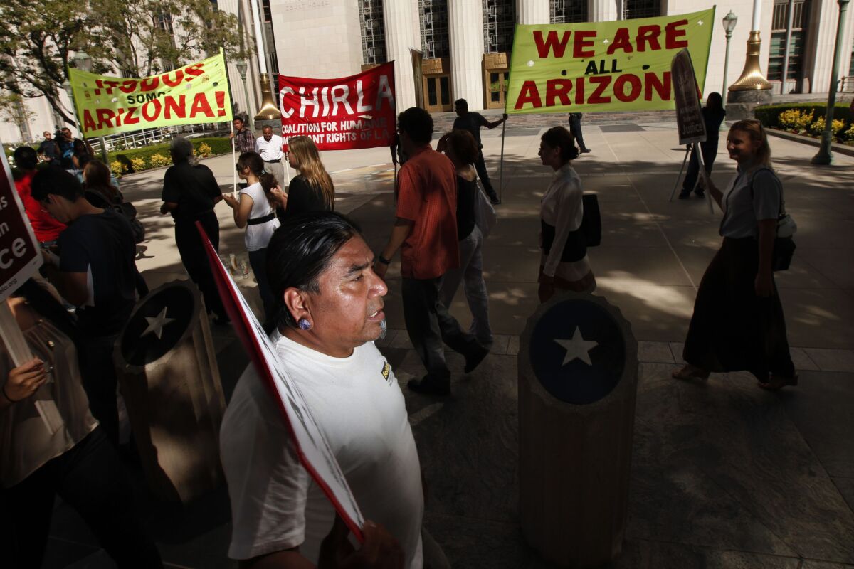 Demonstrators march in Los Angeles in 2012 during a rally over Arizona's strict immigration law, SB 1070.