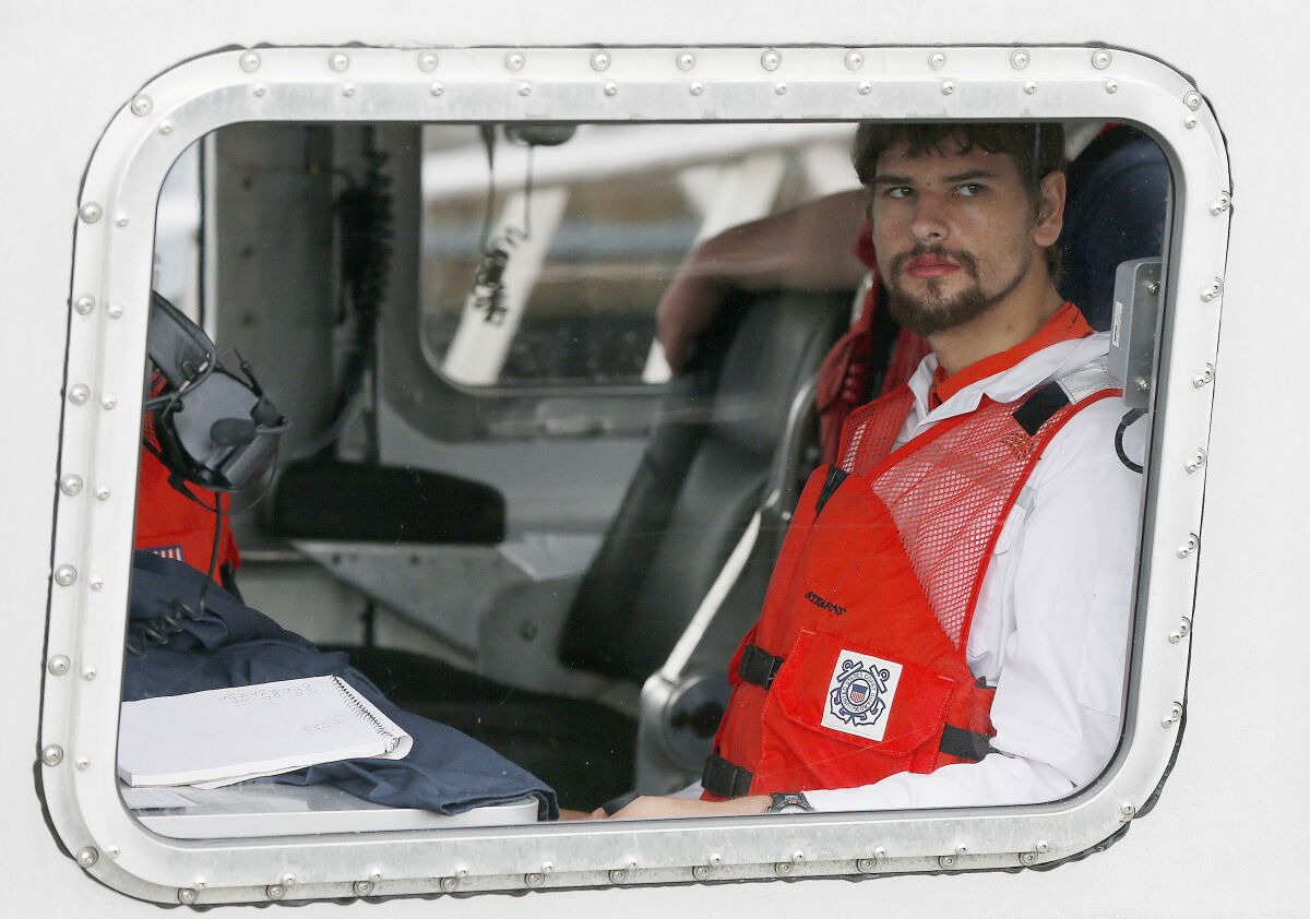 FILE — Nathan Carman arrives in a small boat at the US Coast Guard station, in Boston, Tuesday, Sept. 27, 2016. Carman spend a week at sea in a life raft before being rescued by a passing freighter. Carman is to be arraigned in federal court, in Rutland, Vt., Wednesday, May 11, 2022, on charges of killing his mother during a fishing trip at sea to inherit the family's wealth. (AP Photo/Michael Dwyer, File)