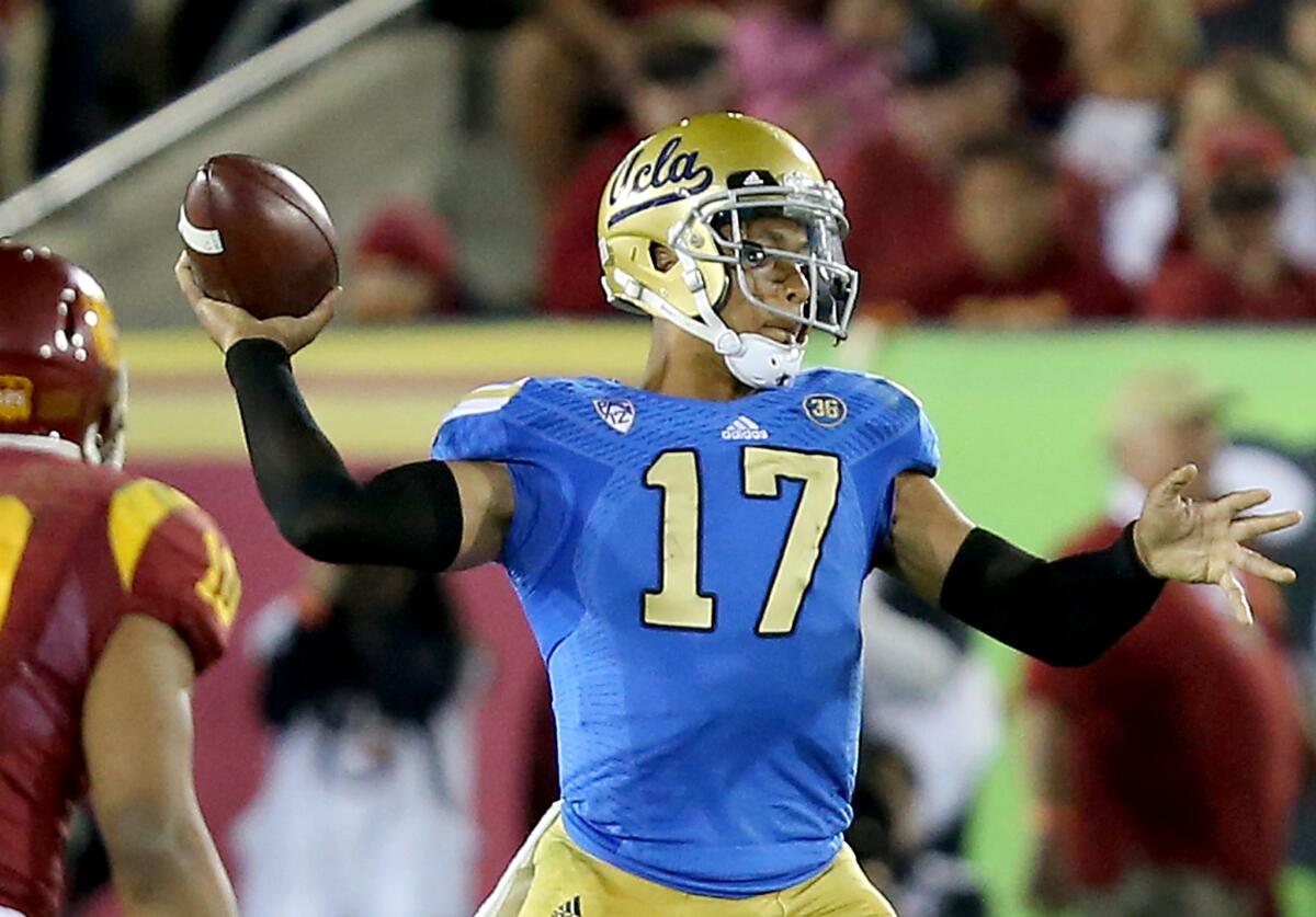 UCLA quarterback Brett Hundley fires a pass against USC during the fourth quarter of the Bruins' second win in a row over the Trojans last year.