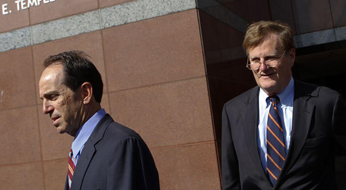 Scott London, left, and his attorney, Harland W. Braun, leave the Edward R. Roybal Federal Building in Los Angeles, where London was arraigned on insider-trading charges.