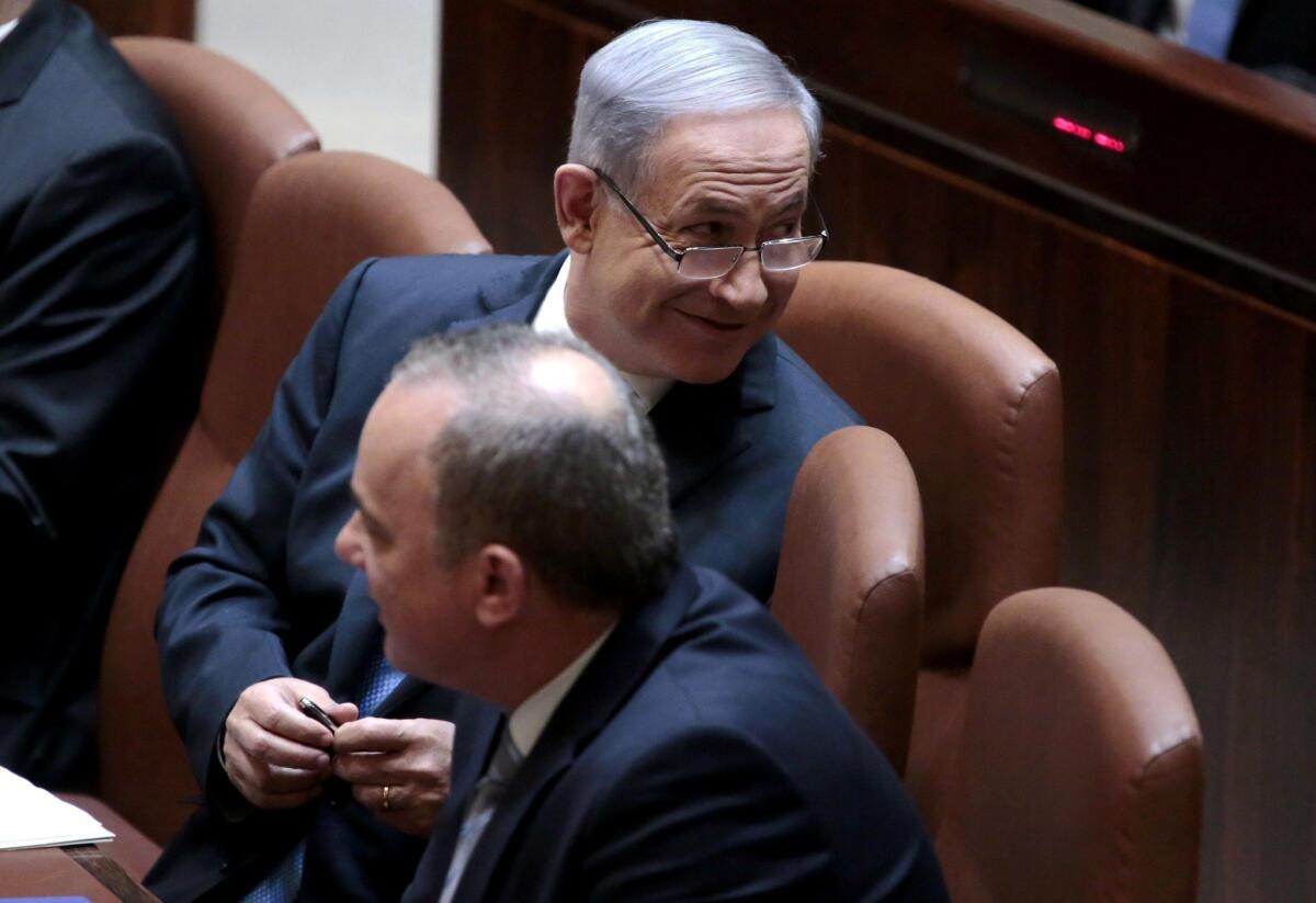 Israeli Prime Minister Benjamin Netanyahu attends a parliament session to present his proposed new government.