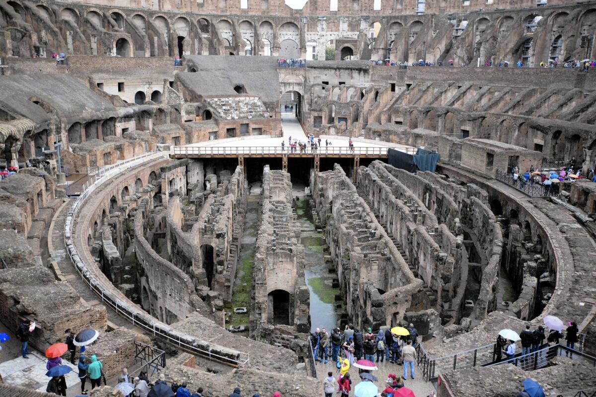 Tourists visit Rome's Colosseum on Nov. 7. A proposal to install a new floor over the ruins of the basement to allow for concerts and other events has the government's backing.