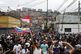 Protesters demonstrate against the official election results declaring President Nicolas Maduro won reelection in the Catia neighborhood of Caracas, Venezuela, Monday, July 29, 2024, the day after the vote. (AP Photo/Cristian Hernandez)