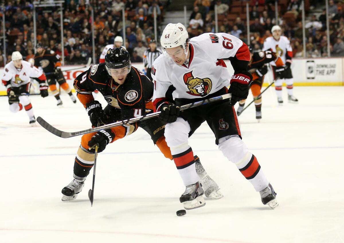 Cam Fowler battles with Ottawa's Mark Stone during the Ducks' 3-0 loss to the Senators on Wednesday at Honda Center.