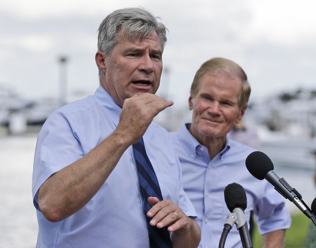 "I'm hoping that after many years of darkness and blockade, this vote can be a first little beam of light," said Sen. Sheldon Whitehouse (D-R.I.), left, with Sen. Bill Nelson (D-Fla.) in Florida last year.