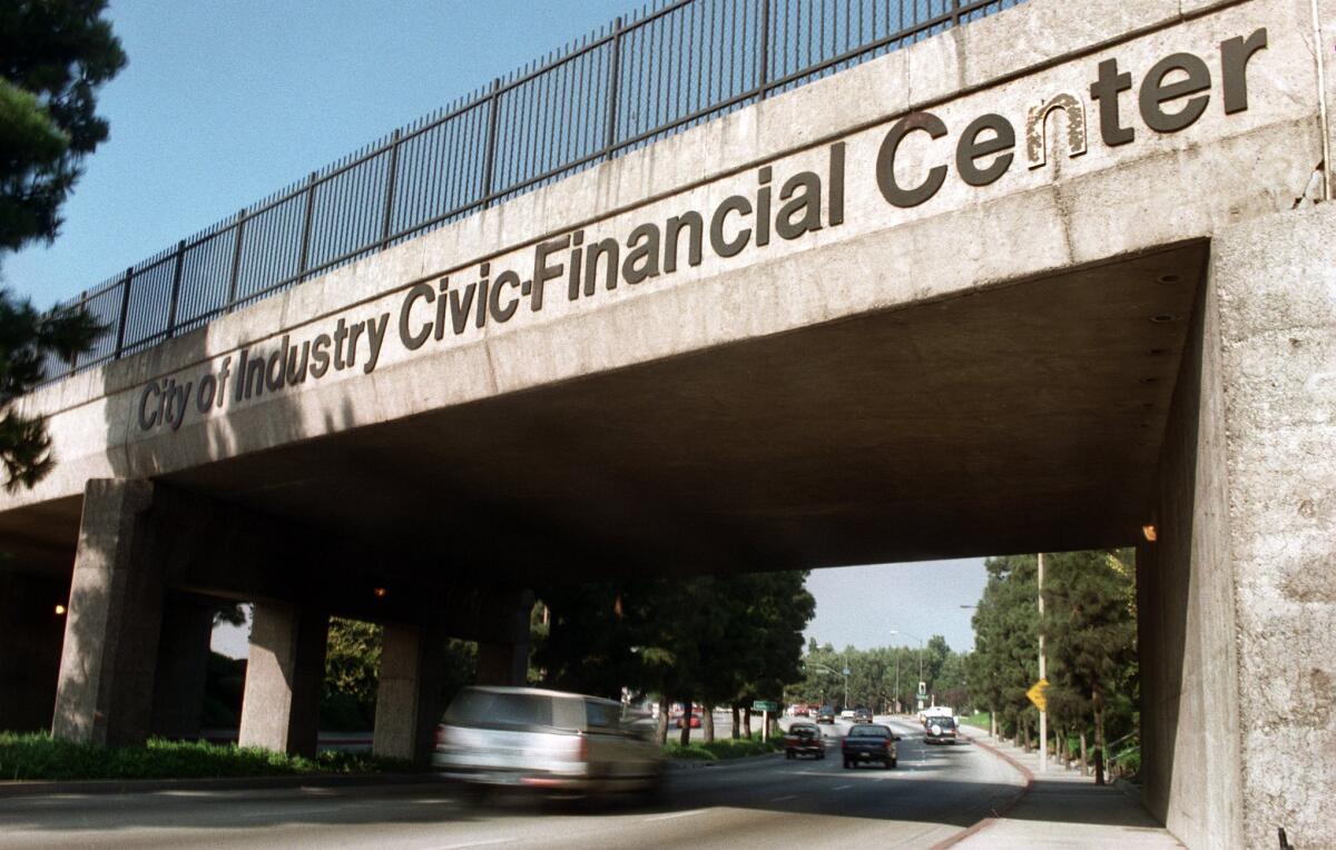 An audit finds that former City of Industry Mayor Dave Perez and his relatives financially benefited from city contracts. Above, one of the larger signs identifying the city on Hacienda Boulevard.