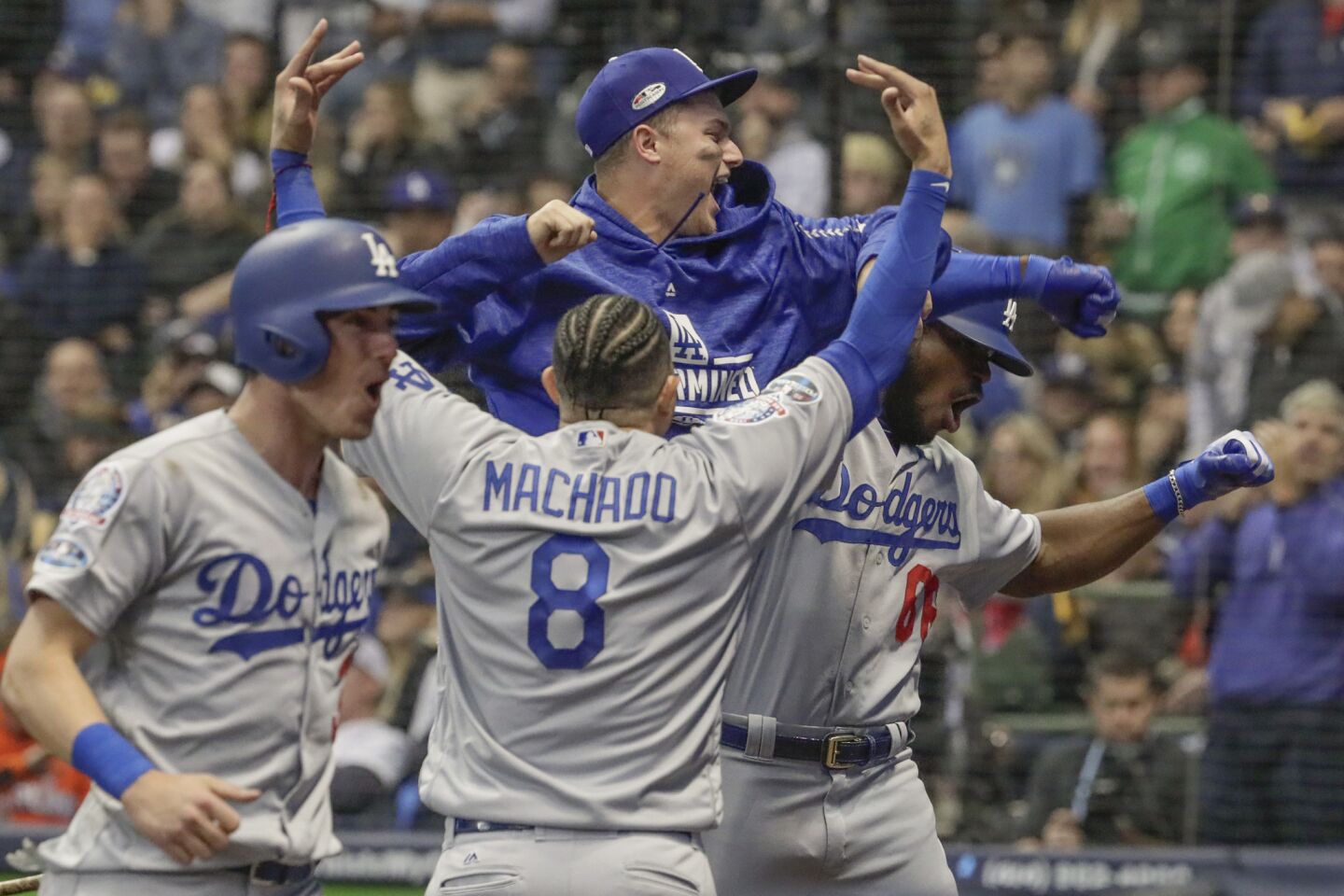 Dodgers Yasiel Puig celebrates with teammates after hitting a three run homer in the sixth inning.