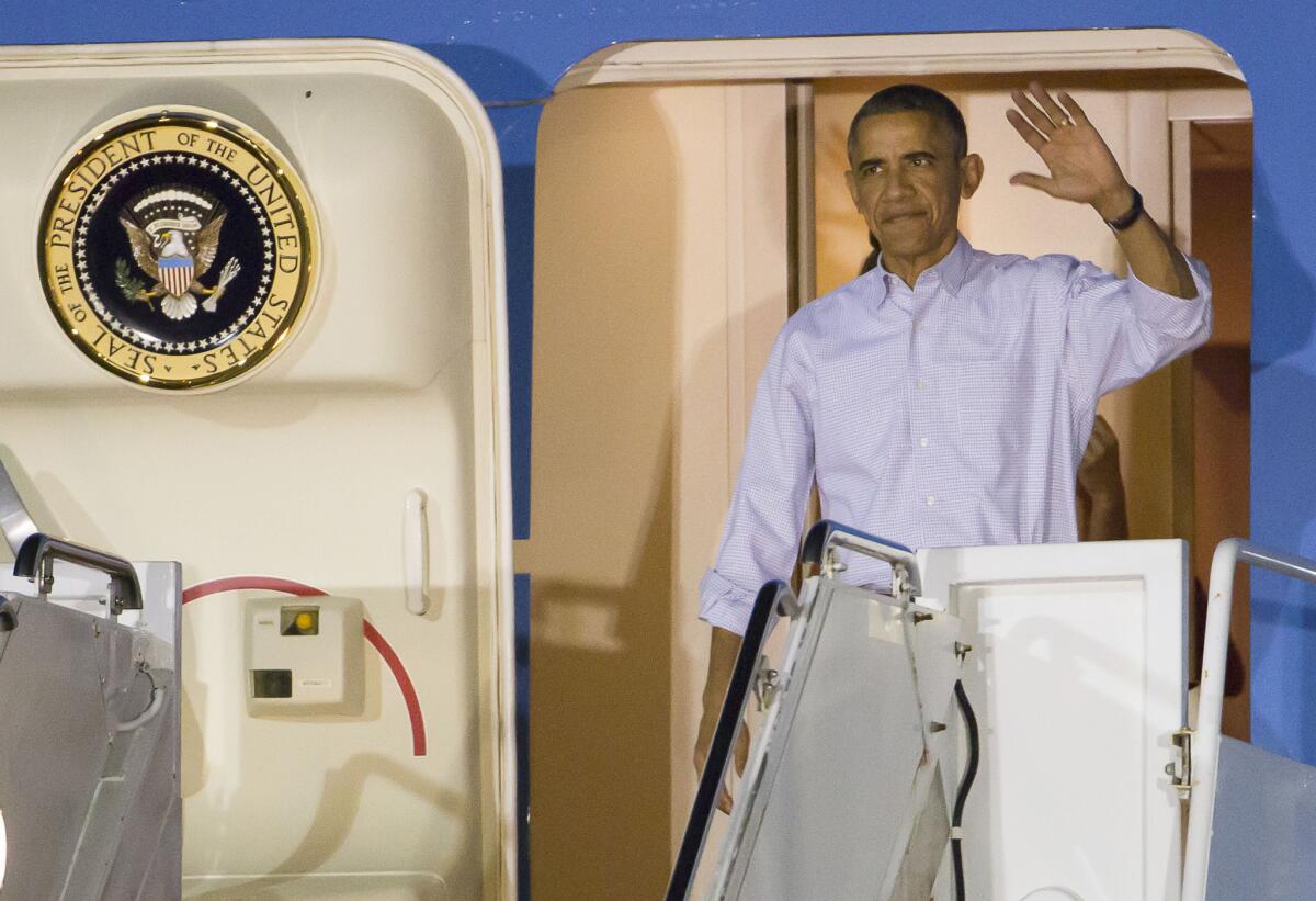 President Obama arrives in Hawaii on Dec. 19 for his family's holiday vacation.