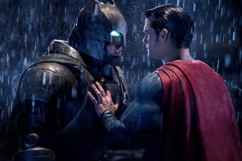 Ben Affleck as Batman, left, and Henry Cavill as Superman in a scene from "Batman V. Superman: Dawn Of Justice."