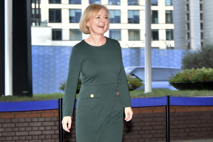 Britain's Prime Minister Liz Truss arrives to attend the Conservative Party conference at the ICC, in Birmingham, England, Saturday, Oct. 1, 2022. (AP Photo/Rui Vieira)