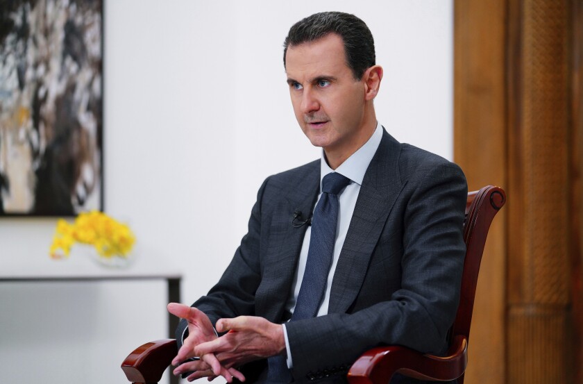 FILE - In this file photo released Nov. 9, 2019 by the Syrian official news agency SANA, Syrian President Bashar Assad speaks in Damascus, Syria. In an interview with Israeli Army Radio, Elazar Stern, Israel's intelligence minister said Tuesday, Dec. 14, 2021, that Syria cannot be allowed to obtain chemical weapons, after a report emerged that Israel targeted the country's chemical weapons facilities. (SANA FILE via AP, File)