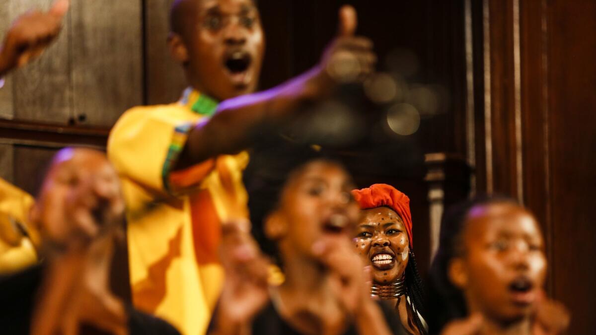 Siphokazi Gcasamba from the Amy Foundation youth choir performs in a concert with the Angel City Chorale, a celebration of its 25th anniversary, featuring music from around the world mixed with pop songs.