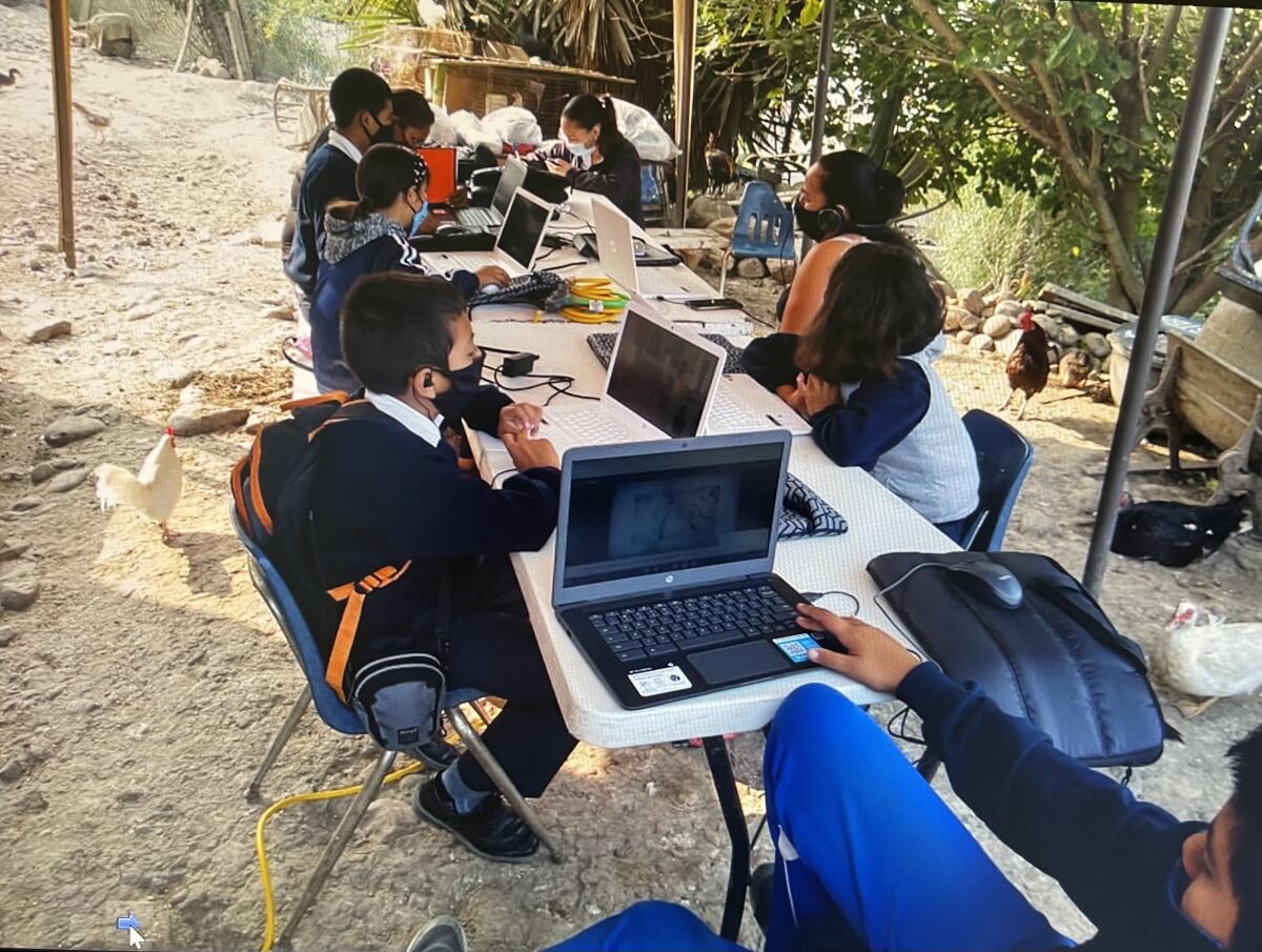 Students with donated laptops