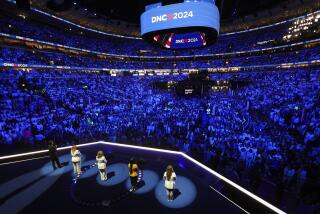 Rep. Lucy McBath, D-Ga., stands onstage and is joined by Abbey Clements of Newton, Conn., Kim Rubio of Uvalde, Texas, Melody McFadden of Charleston, S.C.,, and Edgar Vilchez of Chicago, during the final day of the Democratic National Convention in Chicago, Thursday, Aug. 22, 2024. (Mike Segar/Pool via AP)