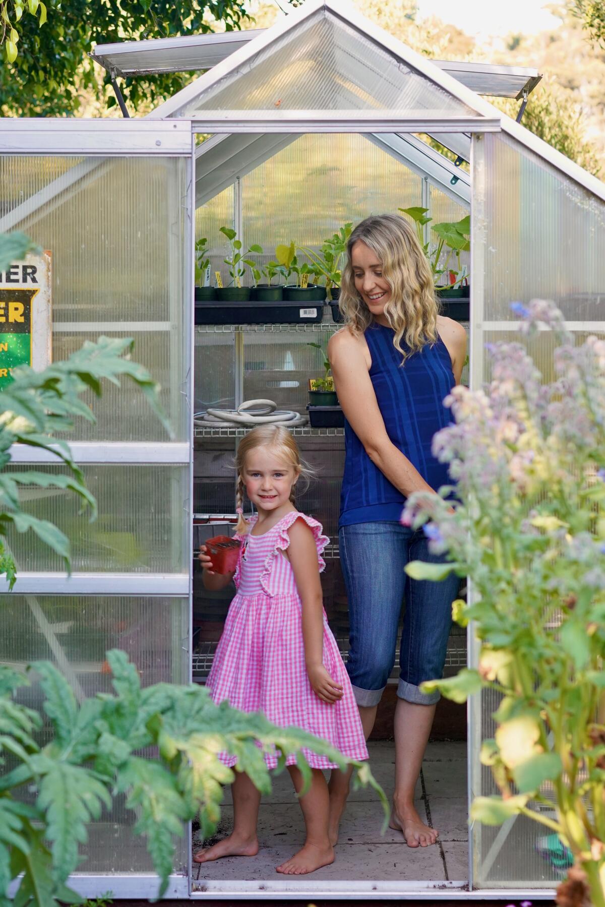 Jen Oliver's daughter Amelia, 5, helps pick the produce grown in their La Jolla backyard.