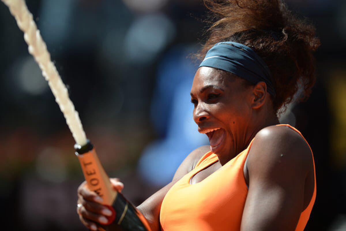 Serena Williams celebrates with champagne after defeating Victoria Azarenka in the Italian Open final on Sunday in Rome.