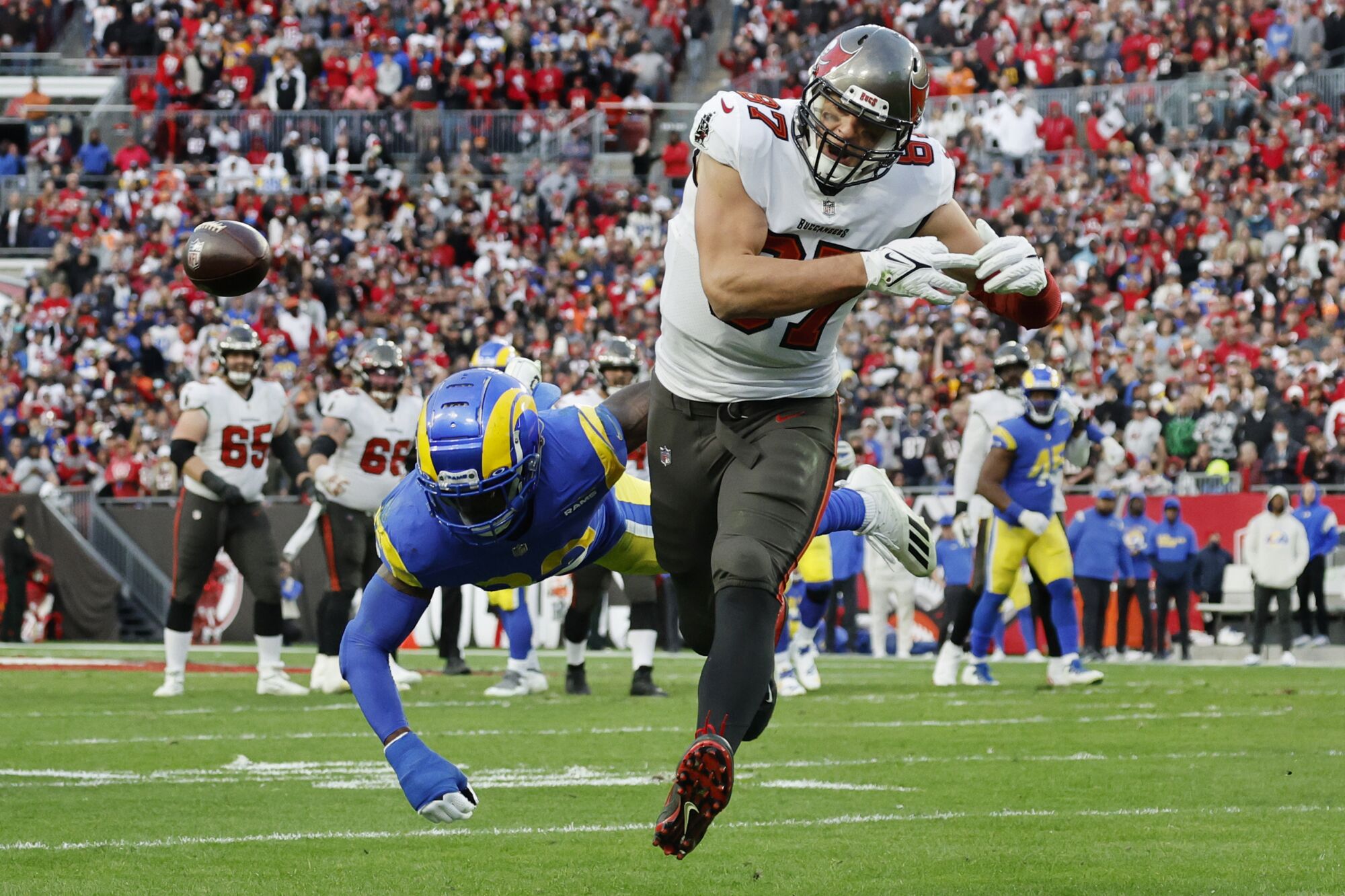 Los Angeles Rams safety Nick Scott breaks up a pass intended for Tampa Bay Buccaneers tight end Rob Gronkowski.