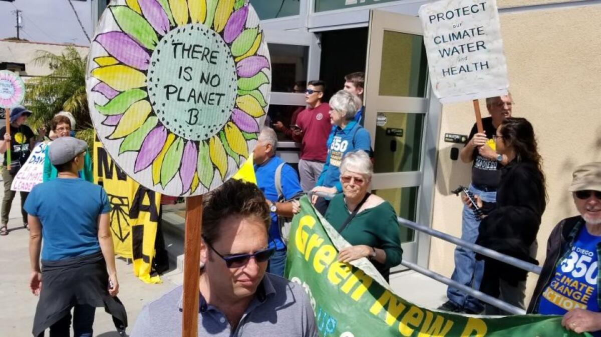 UCSD Professor Adam Aron (lower left) joined other climate activists in a protest at Rep. Susan Davis’ office in San Diego on March 19, 2019.