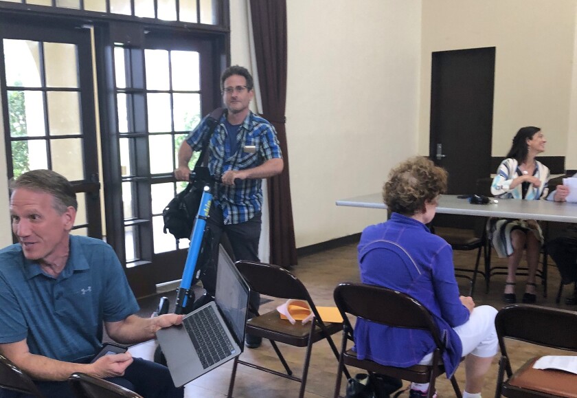 Corey Levitan concludes his scooter ride at a La Jolla Traffic & Transportation meeting about scooters.