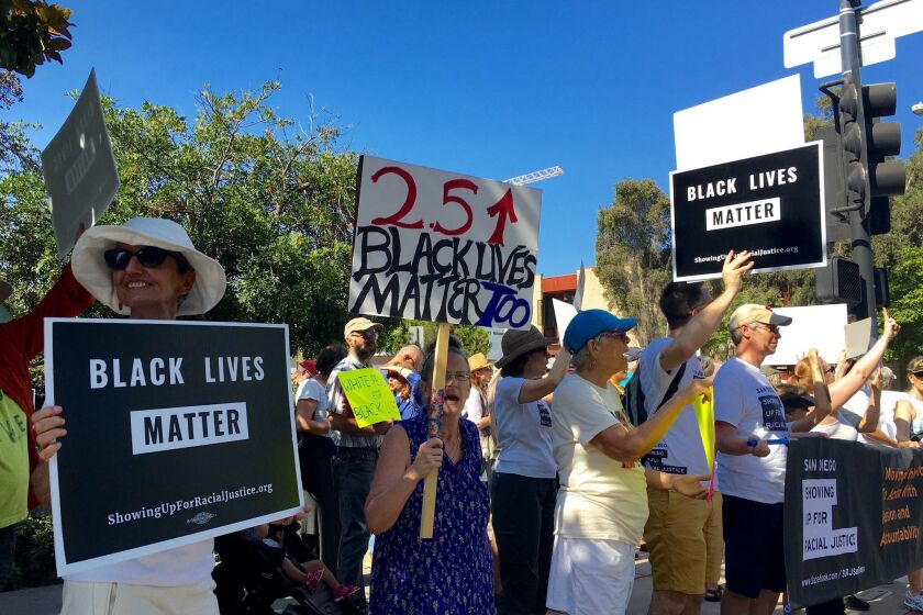 White residents of San Diego demonstrated at police headquarters Thursday to call for racial equality.
